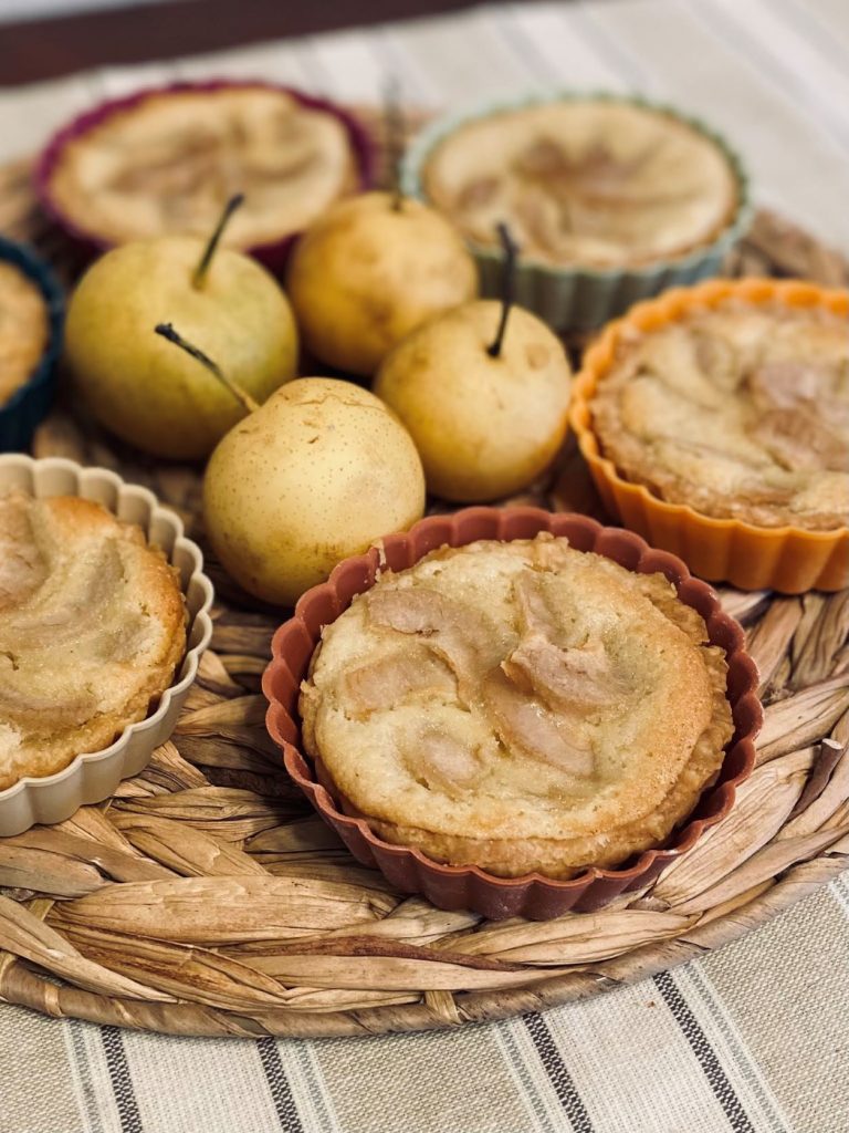 simple fresh pear tarts with almond filling on wicker placemat